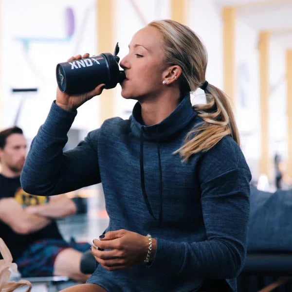 Picture of athlete drinking from a shaker